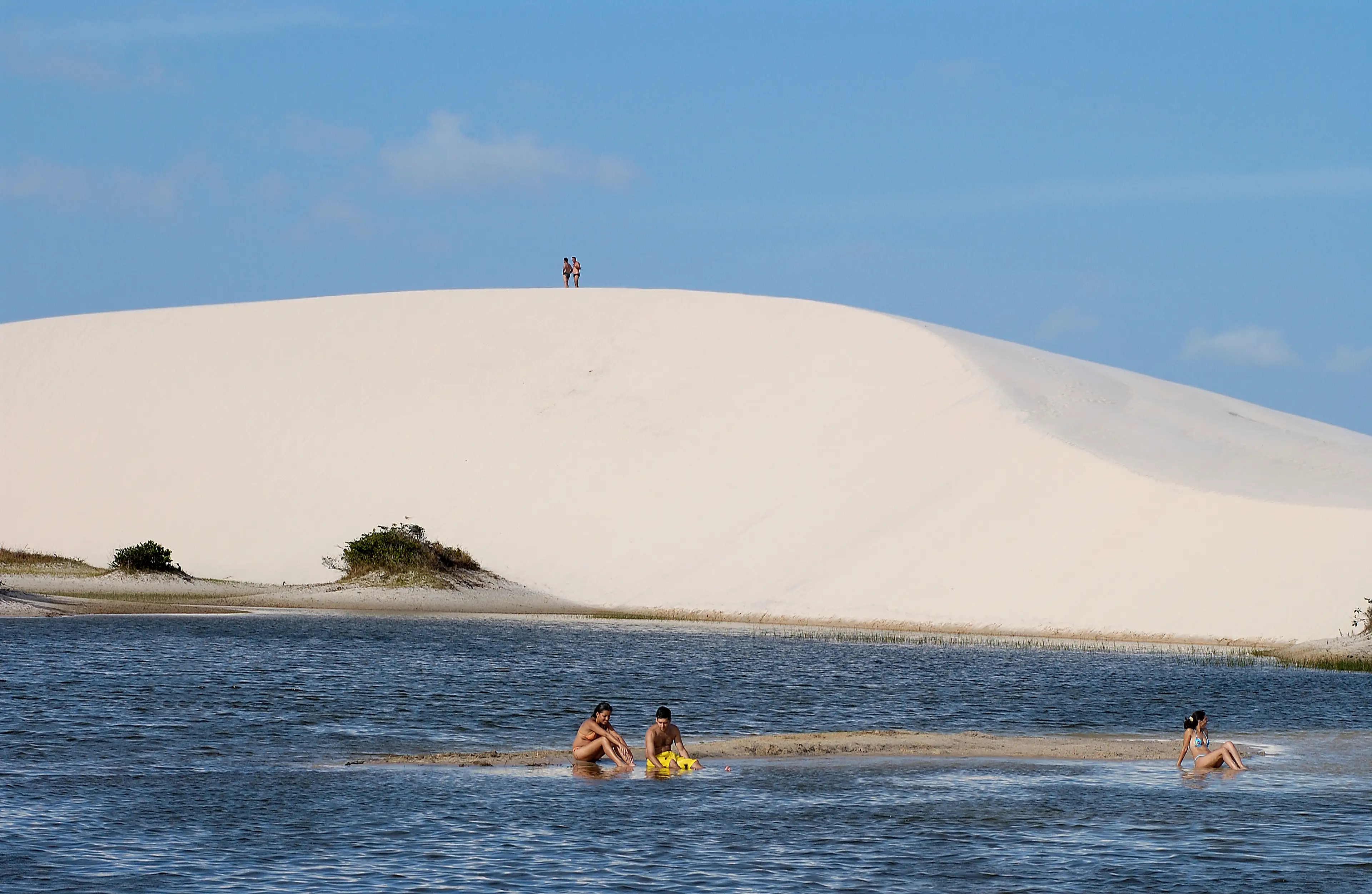 Tourists at the at the Peixe lago in the Lencois Marenhenses park (philippe giraud/Corbis via Getty Images)