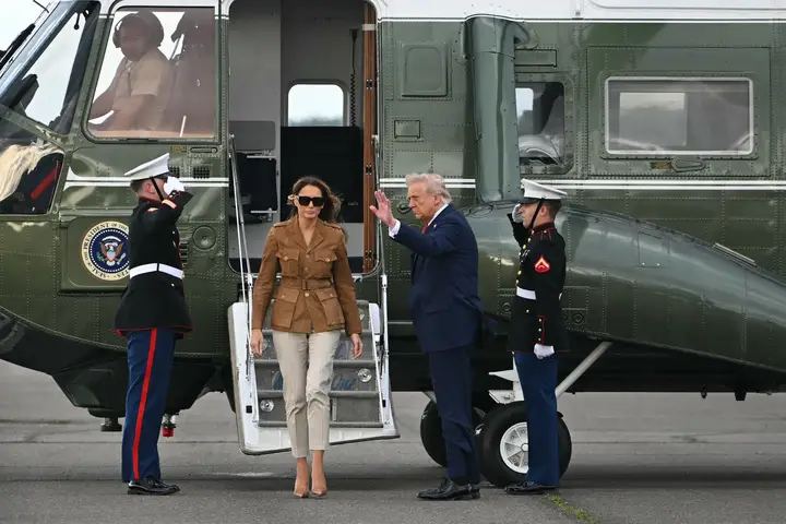 Melania Trump and her husband outside of their Marine One helicopter (ANDREW CABALLERO-REYNOLDS/AFP via Getty Images)