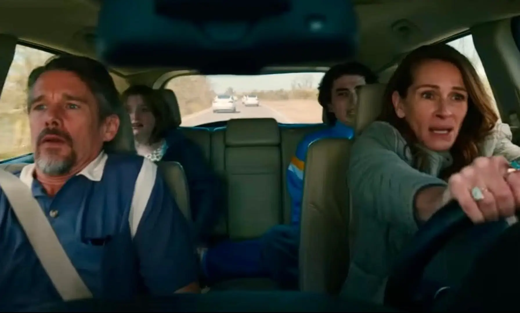 The family is then forced to dodge a stream of hacked Tesla’s speeding directly at them.