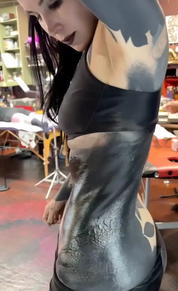 Kat Von D said she's spent almost 40 hours 'blacking out' her body to cover her old tattoos.