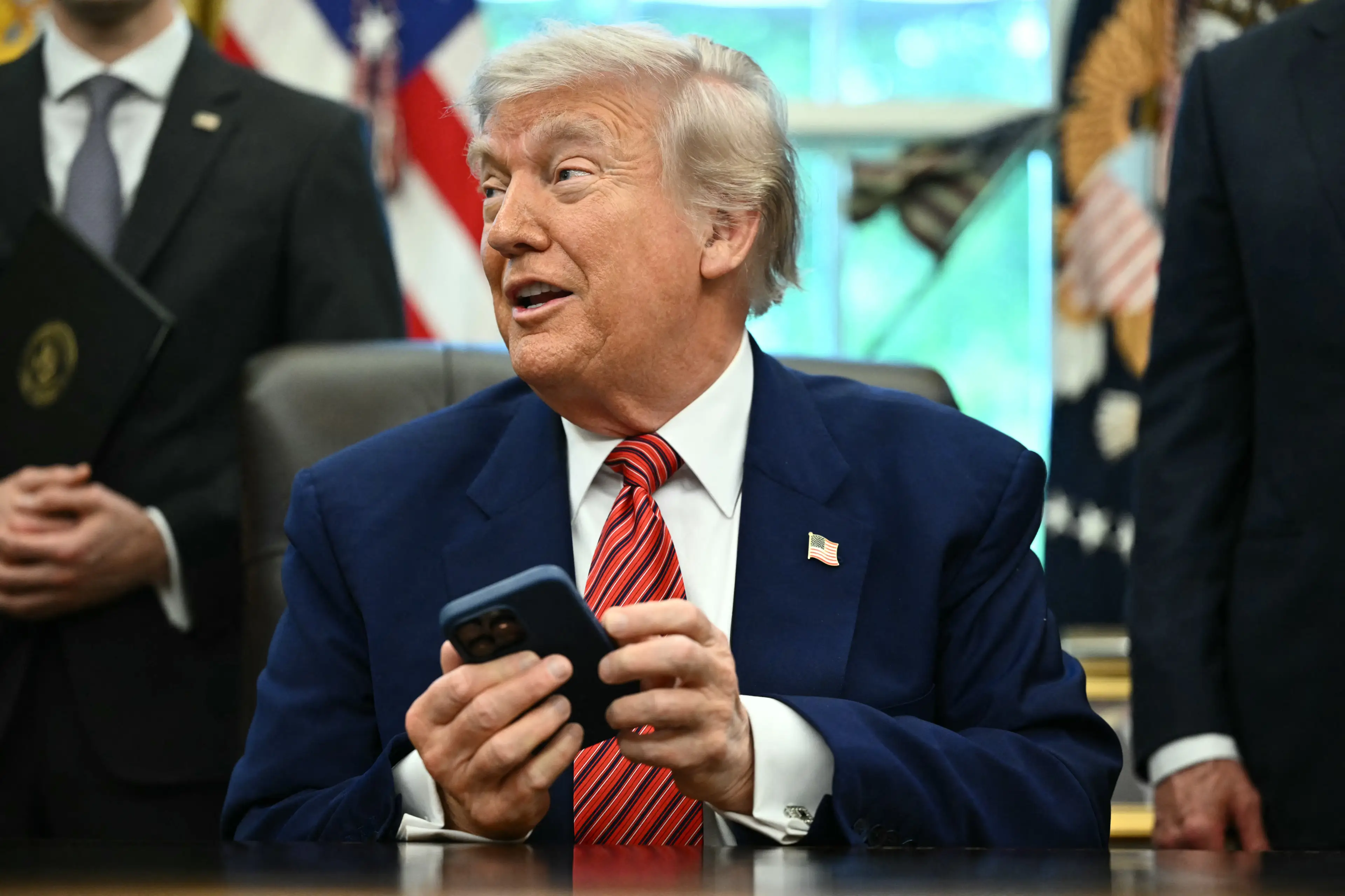 The president of the United States usually has his cellphone close by (MANDEL NGAN/AFP via Getty Images)