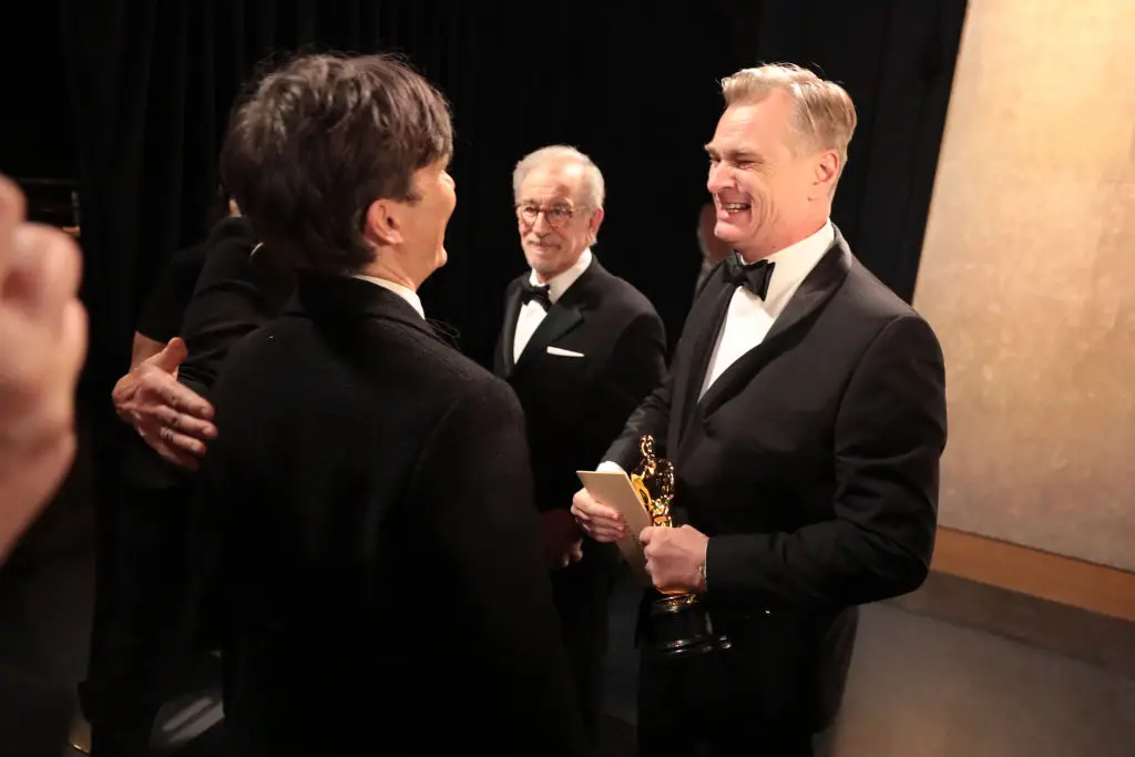 Christopher Nolan smiles at Cillian Murphy at the 96th annual Academy Awards ceremony - where they both scooped Oscars for their part in Oppenheimer (Al Seib/A.M.P.A.S. via Getty Images)