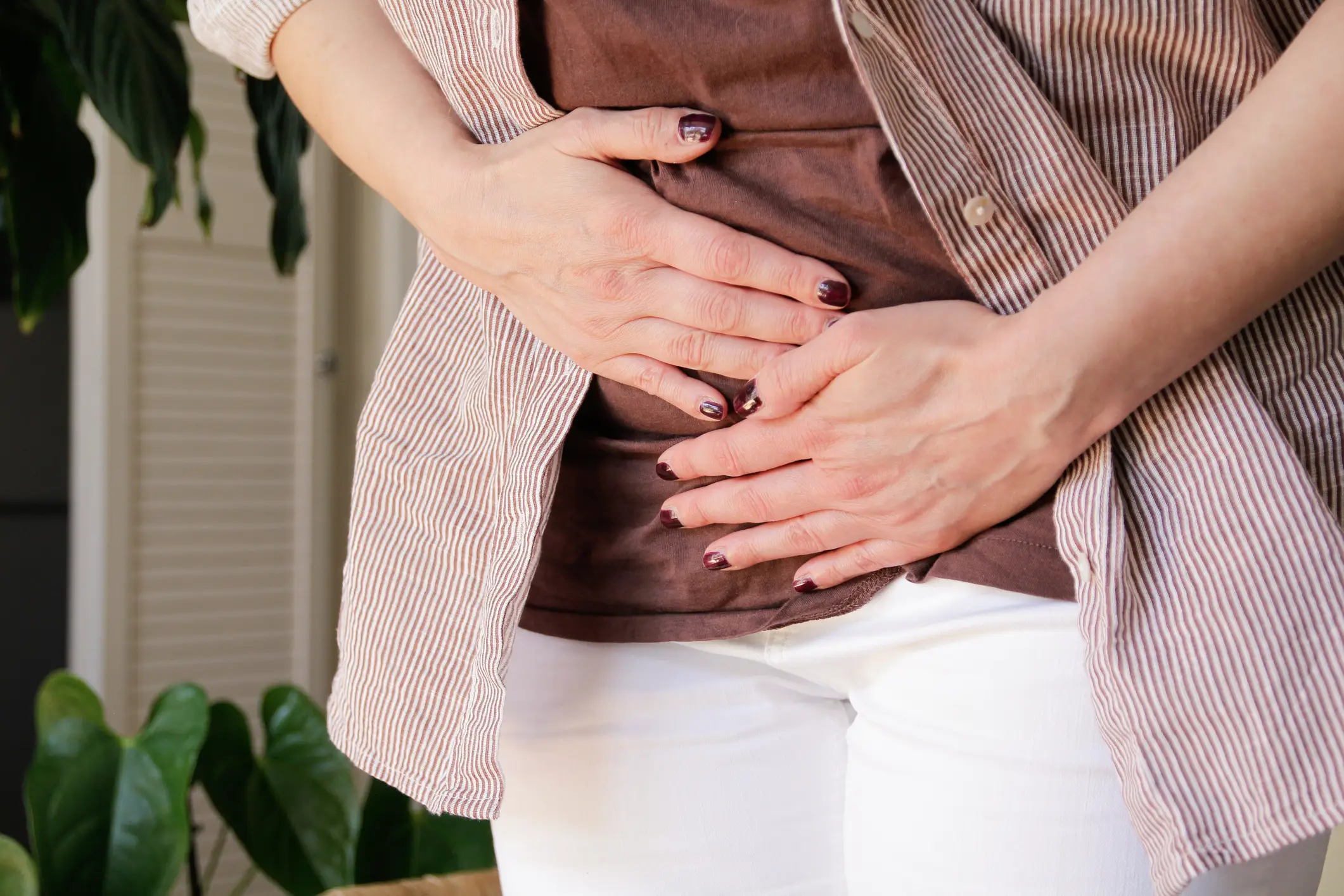 Abdominal pain is a key symptom of colon cancer (Getty stock image)