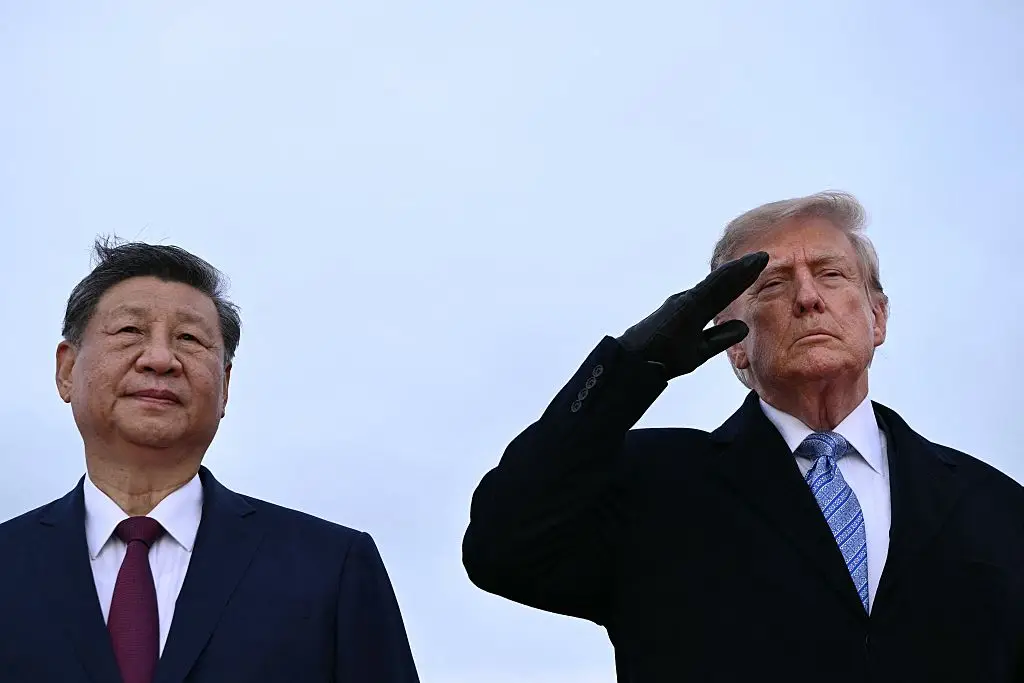 A jet flew overhead as the pair stood together (Photo by Brendan SMIALOWSKI / AFP via Getty Images)