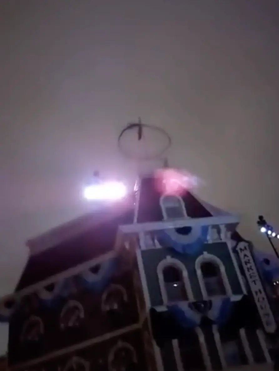 Apparently it's a smoke ring from a fire show.