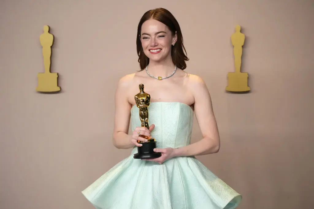 Stone grips her second Academy Award that she received for her role as Bella Baxter in Poor Things earlier this year (Jeff Kravitz/FilmMagic)