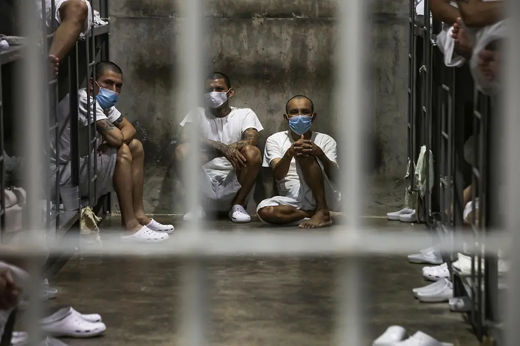 Prisoners look out of their cell at CECOT, where they are only given 30 minutes to exercise (Alex Peña/Getty Images)
