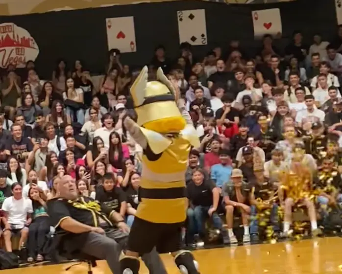 The video shows the principal with the school's mascot (Facebook/ Ryan Attebery) 
