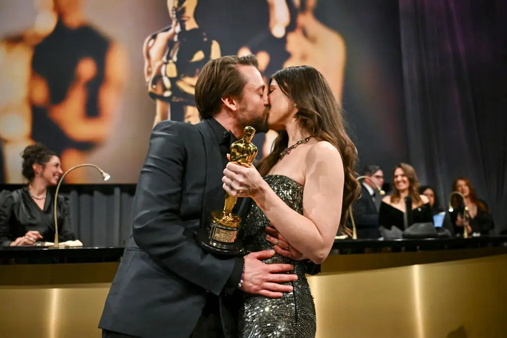 Kieran Culkin kisses wife Jazz Charton after scooping an Oscar for his supporting role in the comedy/drama 'A Real Pain' (ANGELA WEISS/AFP via Getty Images)
