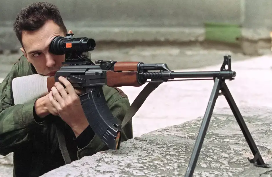 A sniper taking aim in Sarajevo (MICHAEL EVSTAFIEV/AFP via Getty Images)