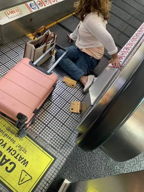 The woman's leg became trapped in the travelator (ViralPress)