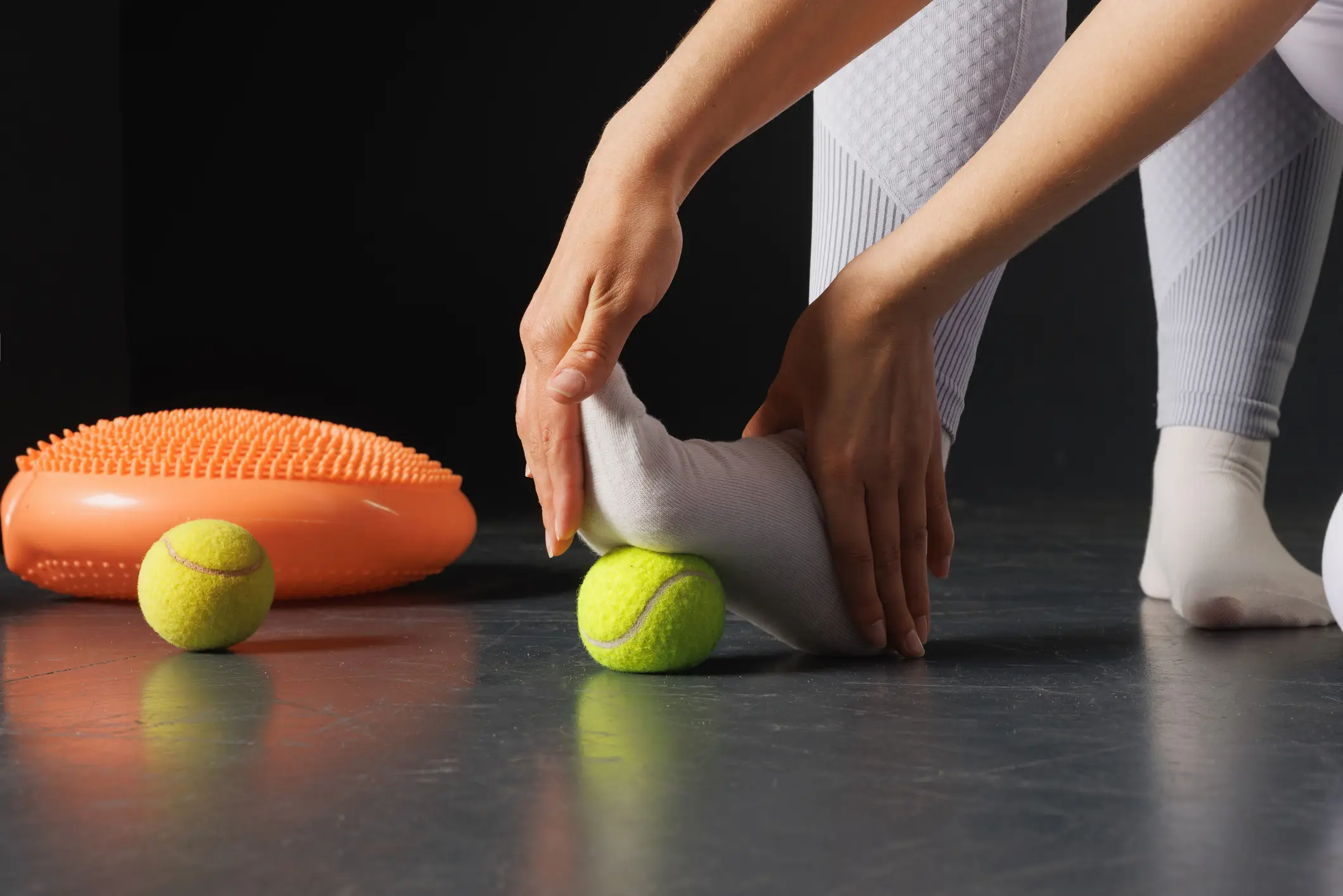 A simple tennis ball can help ease muscle tension during long flights (Getty Stock Images)