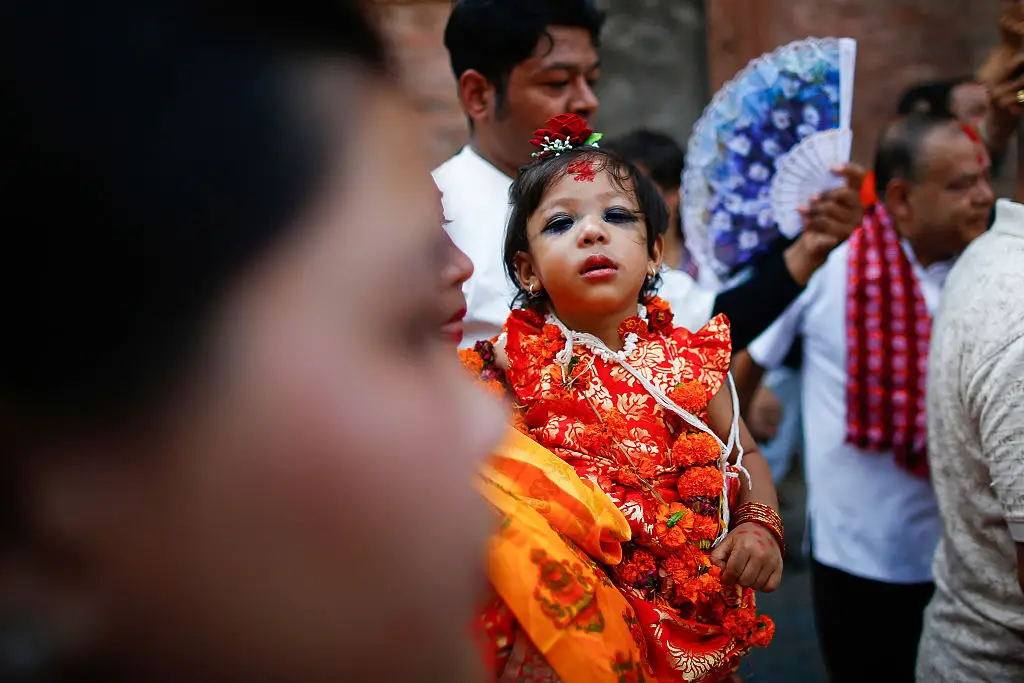 Two-year-old Aryatara Shakya, seen carried by her mother to the Kumari residence, has become the latest living goddess in Nepal (Skanda Gautam/SOPA Images/LightRocket via Getty Images)