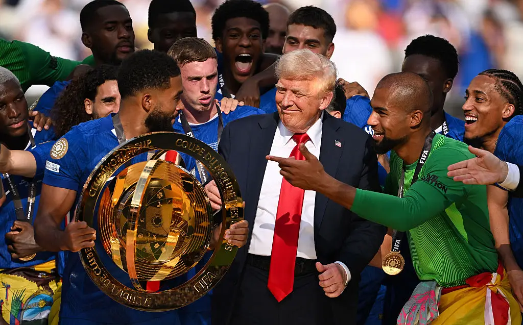 Donald Trump stayed with the football team as they celebrated their win (David Ramos/Getty Images)