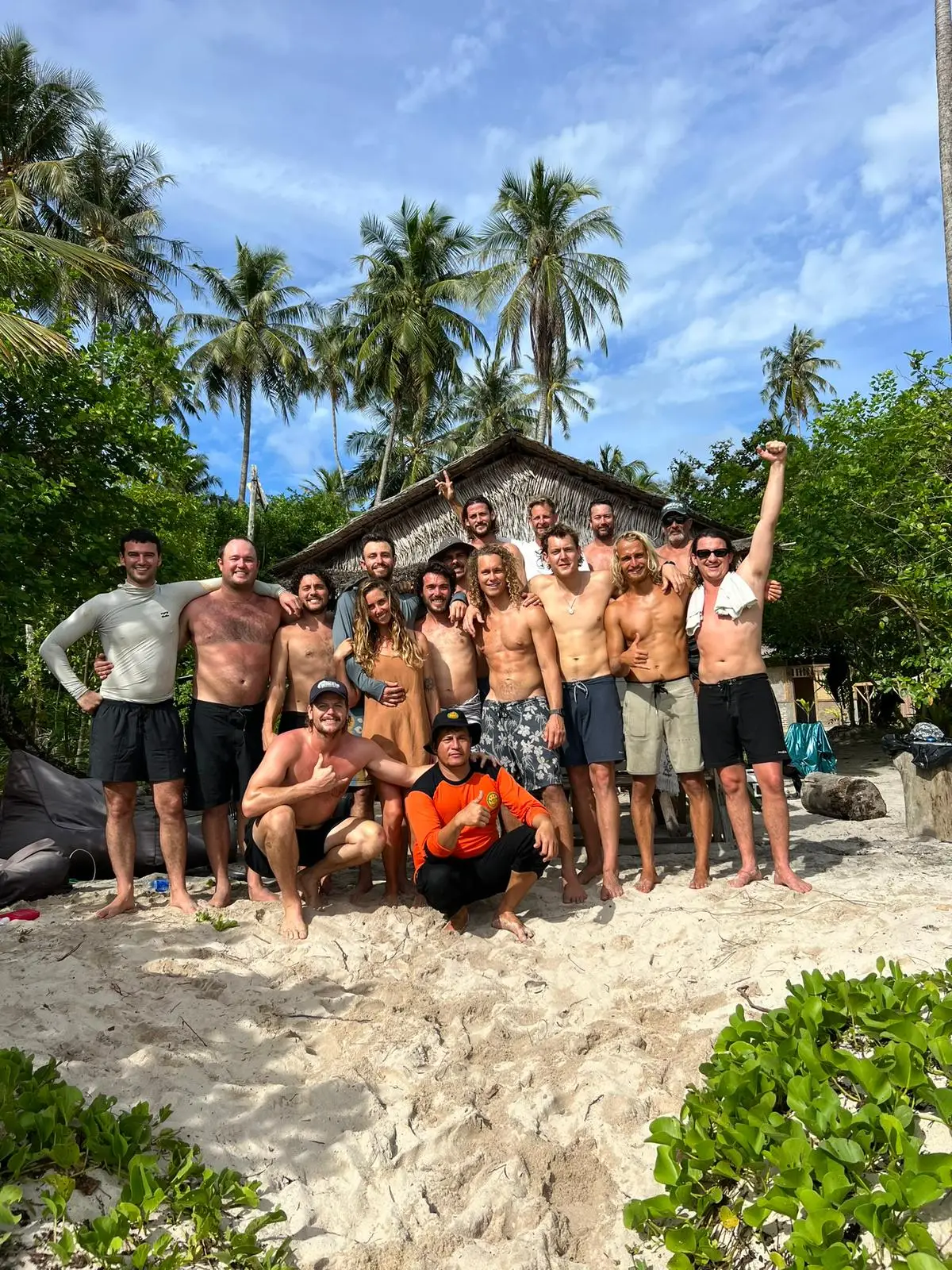 Elliot Foote, pictured fifth from the left posing with his girlfriend at the time Steph Weisse, alongside their entire travelling party - and the crew from the Sea Mi Amor which came to help look and were integral in the rescue effort (Courtesy of Elliot Foote)