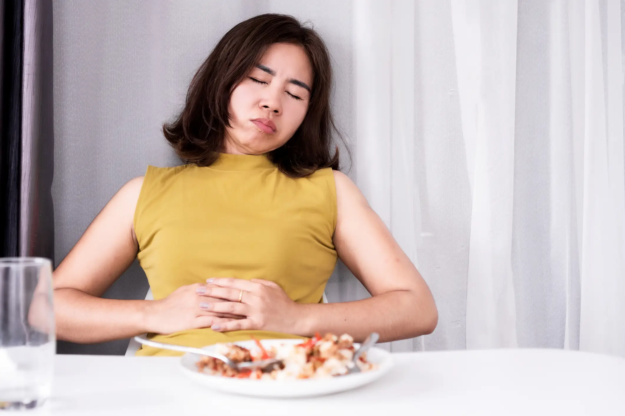 Feeling full quickly could be a sign of bowel cancer (Getty Stock Photo)