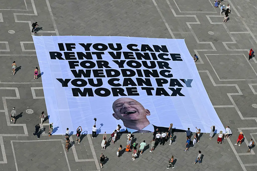 The gigantic poster could be seen in Piazza San Marco (STEFANO RELLANDINI/AFP via Getty Images)