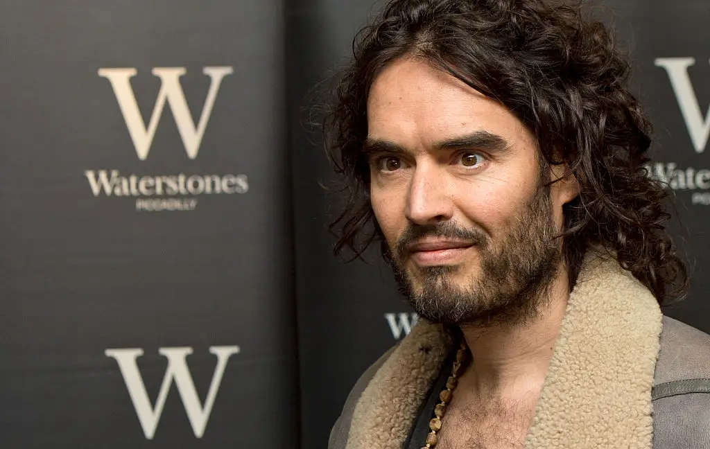 Russell Brand's new book has not gone down well in literary circles (Photo by Zak Hussein/Corbis via Getty Images)
