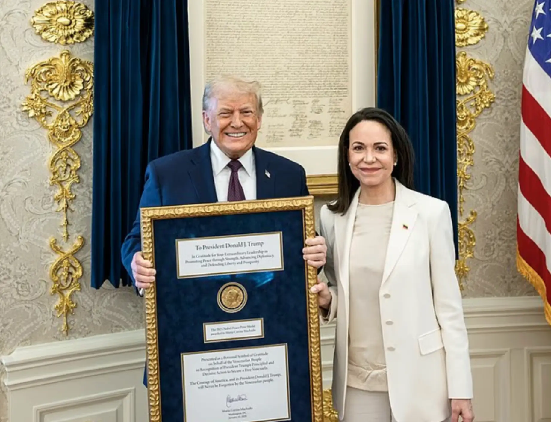 Donald Trump pictured with Machado and the medal in the Oval Office (Daniel Torok/The White House via Getty Images)
