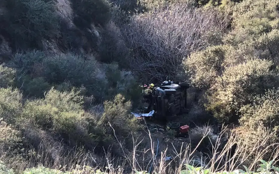 Rescue workers descended down the drop to the car.