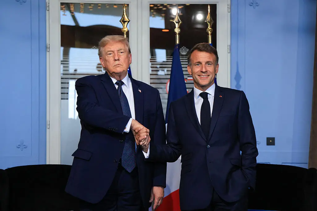 Trump and Macron's handshake has raised eyebrows (Ludovic MARIN / POOL / AFP via Getty Images)