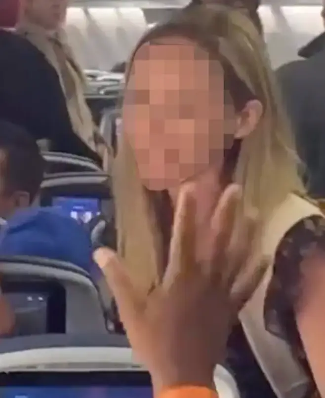The woman argued she has a right to put her seat back.