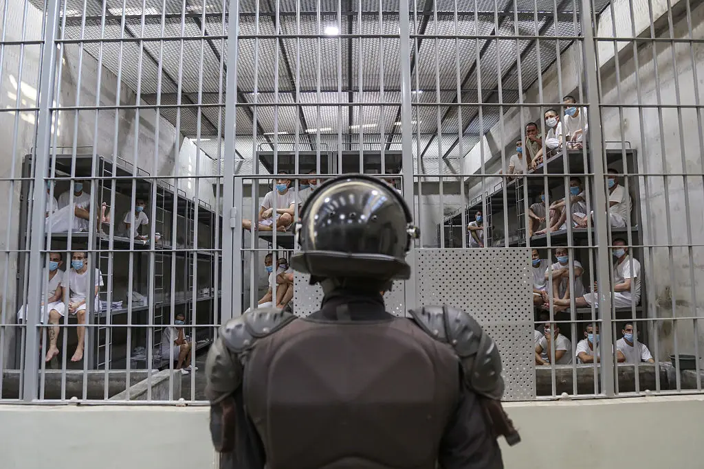 A prison officer guards a cell at maximum security penitentiary CECOT, in El Salvador (Alex Peña/Getty Images)