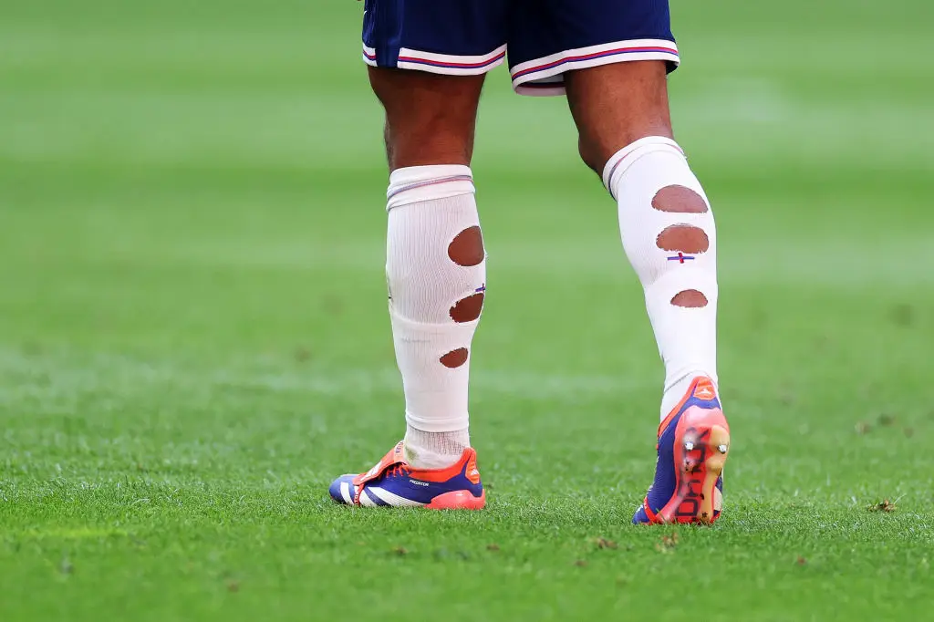 Some players cut holes in their socks (Dean Mouhtaropoulos/Getty Images)