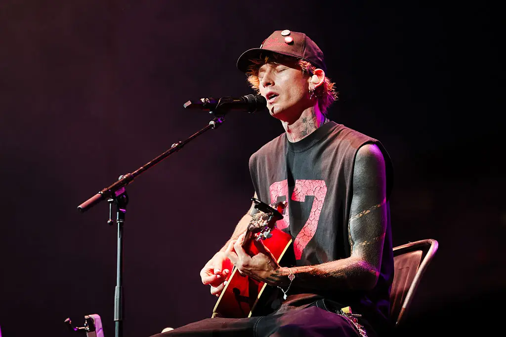 Blackout tattoos carry significant health and medical risks due to the massive volume of ink injected into the skin, though they are not inherently lethal when performed by a professional. (Photo by Christopher Polk/Billboard via Getty Images)