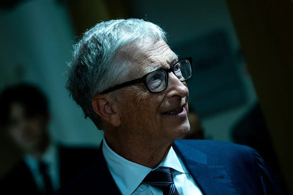 Gates has proposed a 'Human Reserved' category of jobs that should remain with people, citing his late father's caregivers as an example. (Photo by Martin Bertrand / Hans Lucas / AFP via Getty Images)
