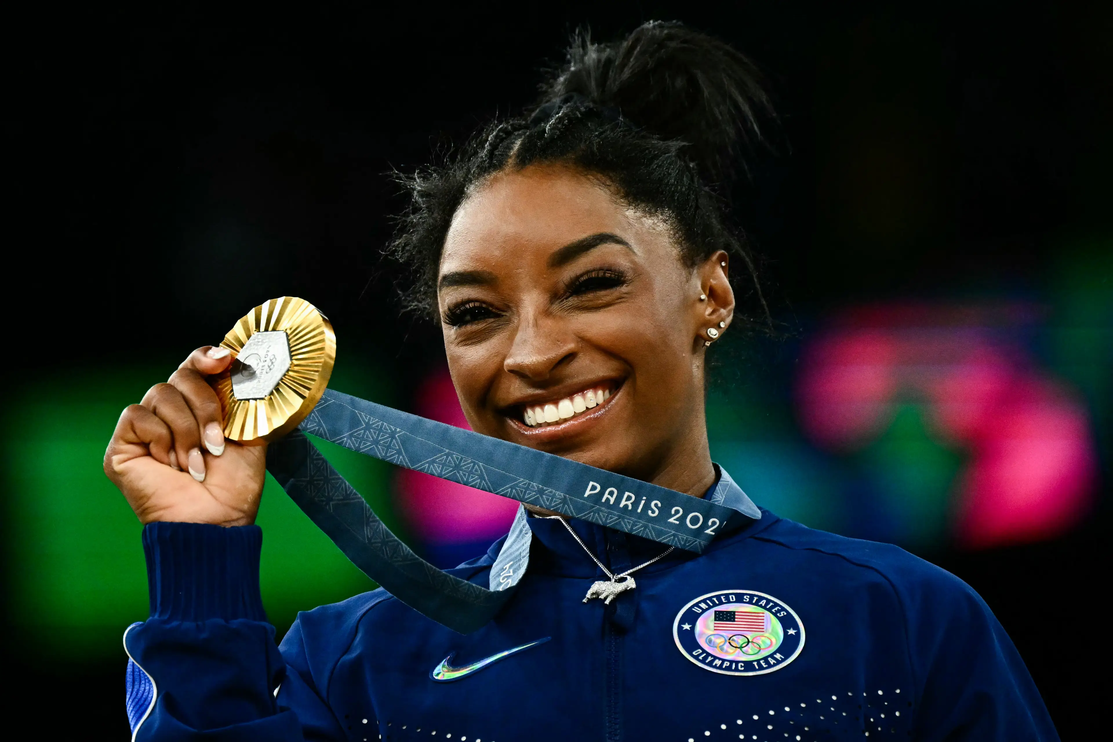 Olympians like Simone Biles will be paid $38,000 reward for winning gold. (LOIC VENANCE/AFP via Getty Images)