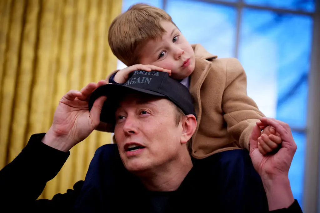 Musk and one of his sons (Andrew Harnik/Getty Images)