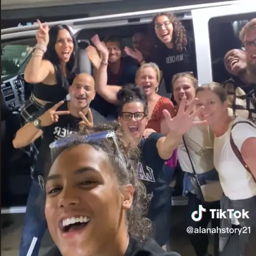 The strangers posed for a picture outside the van before setting off.