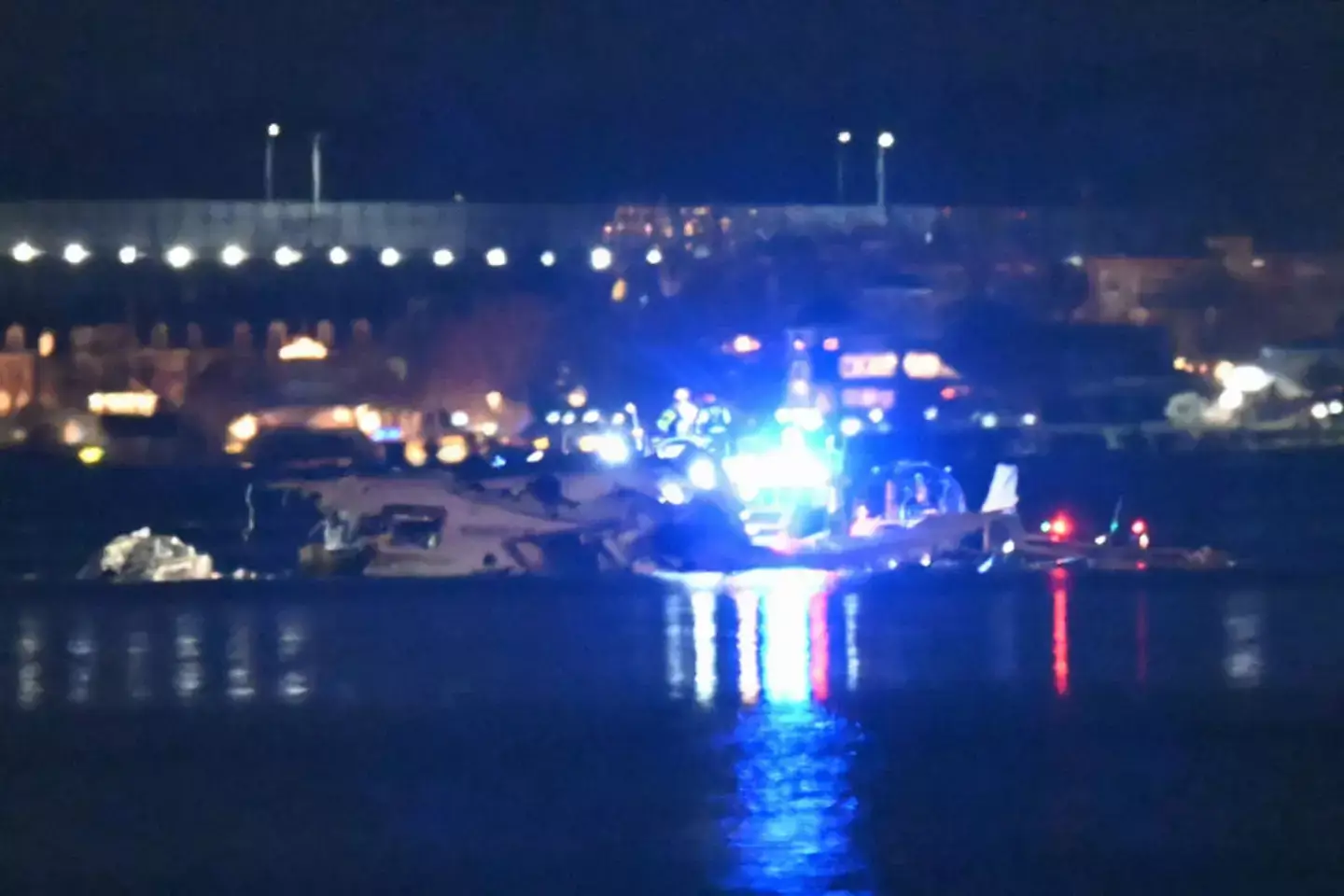 Part of the wreckage is seen as rescue boats search the waters of the Potomac River (ANDREW CABALLERO-REYNOLDS/AFP via Getty Images)
