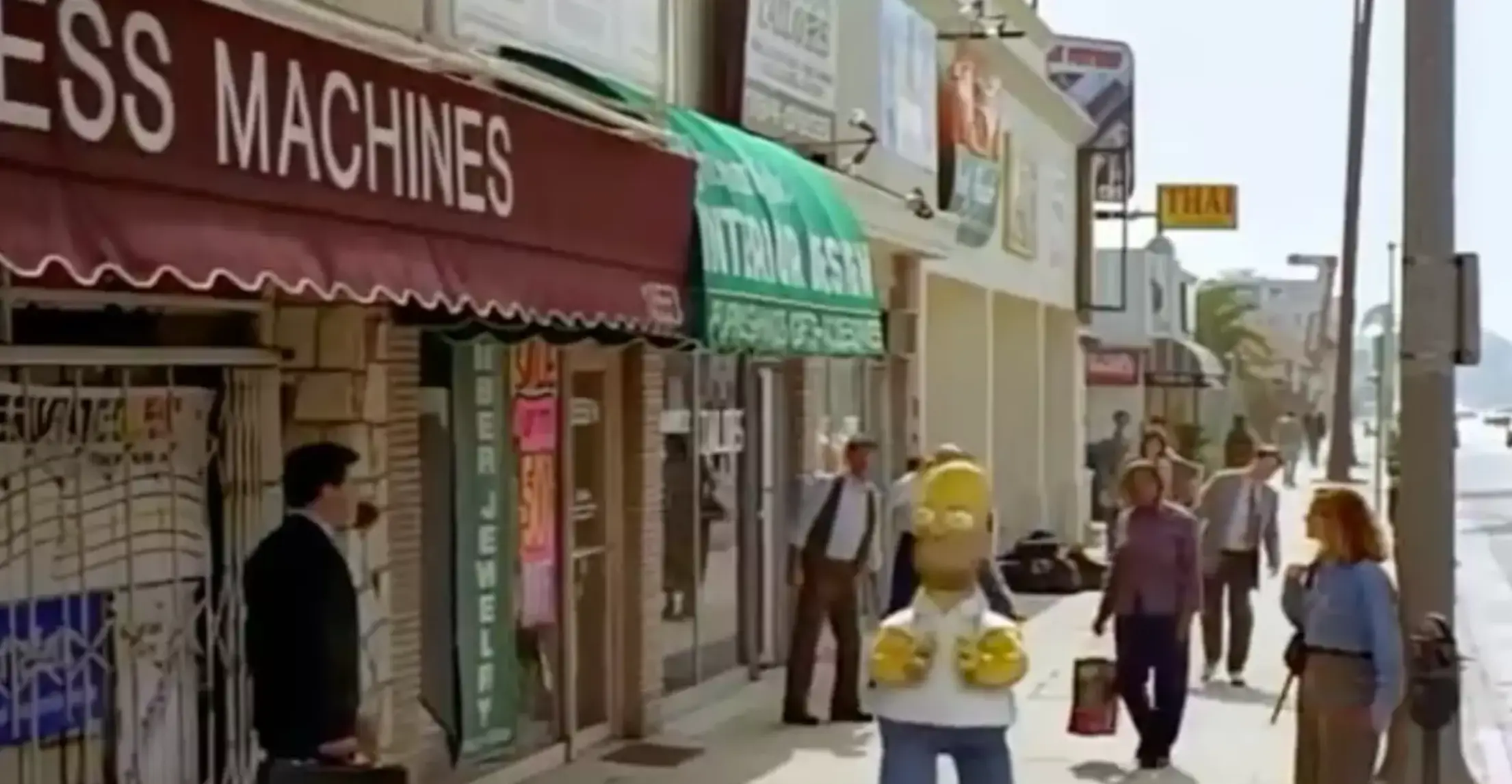 Homer can be seen walking around the street looking terrified (Disney)