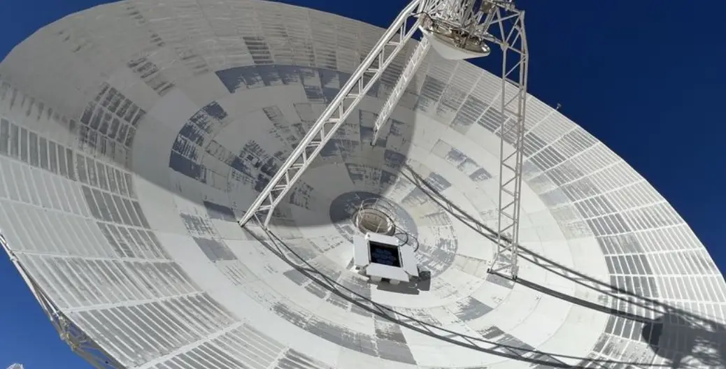 The new optical device being attached to the radio antenna.