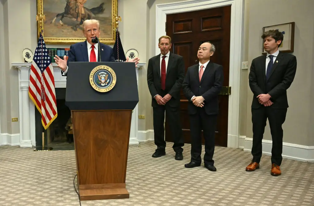 President Donald Trump speaks in the Roosevelt Room flanked by Masayoshi Son (2R), Chairman and CEO of SoftBank Group Corp, Larry Ellison (2L), Executive Charmain Oracle and Sam Altman (R), CEO of OpenAI (JIM WATSON/AFP via Getty Images)