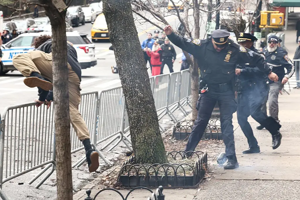 Two counter-protesters have been arrested for throwing explosives (Photo by CHARLY TRIBALLEAU / AFP via Getty Images)