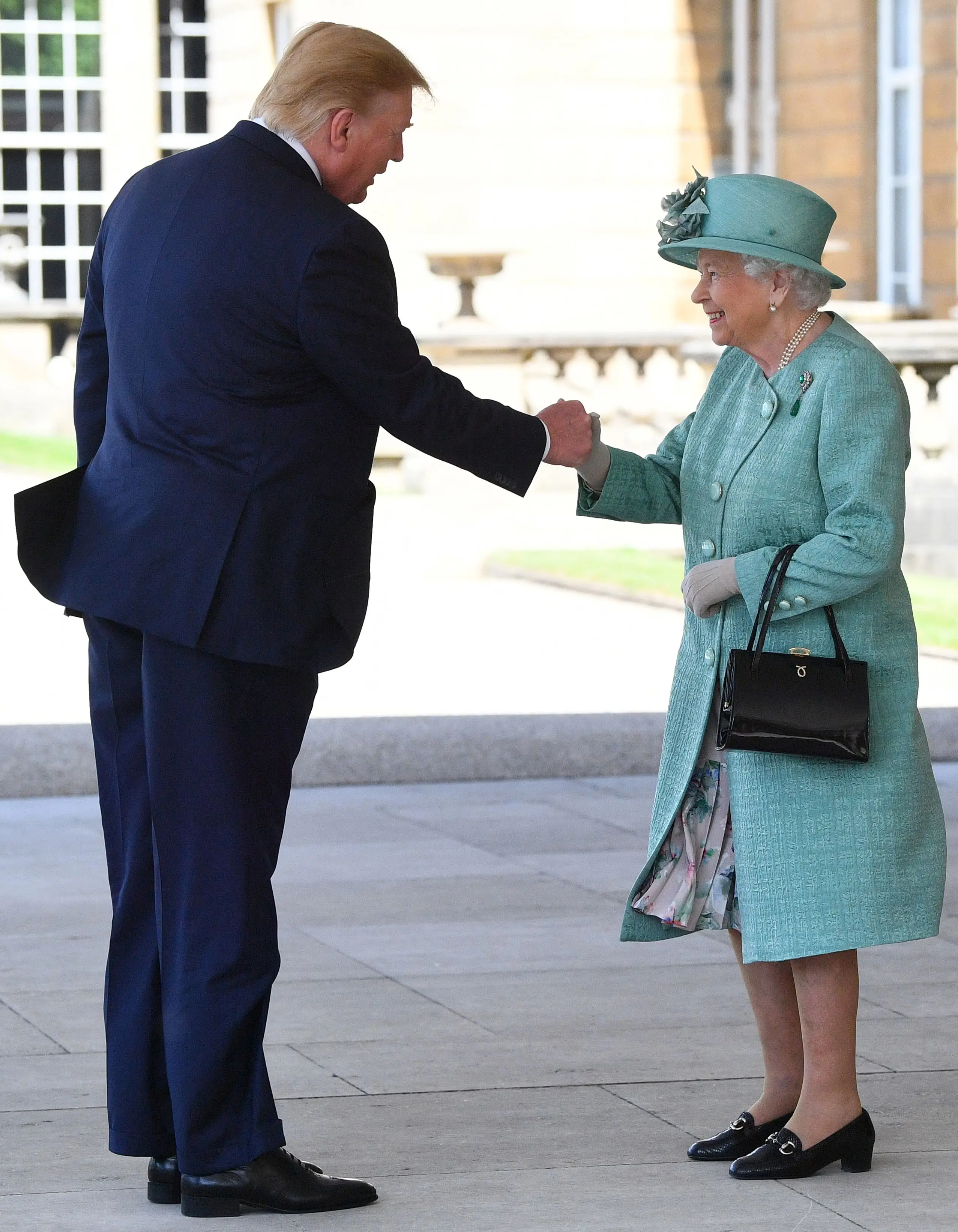 The President was accused of 'fist bumping' Queen Elizabeth II (VICTORIA JONES/POOL/AFP via Getty Images)