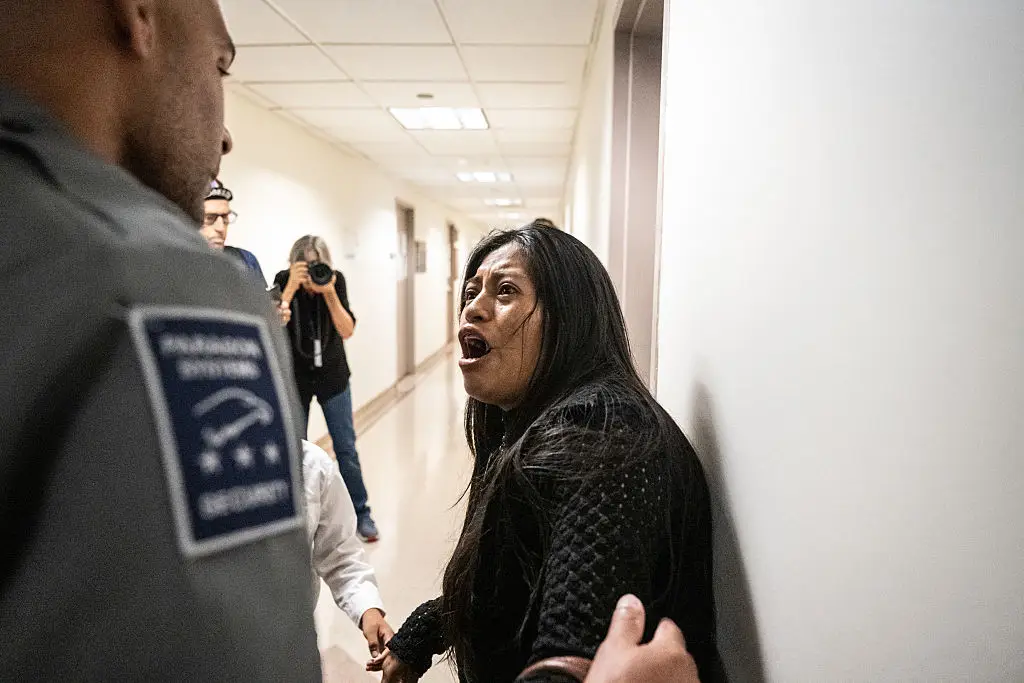 A woman became distressed after her husband was arrested by ICE (Stephanie Keith/Getty Images)