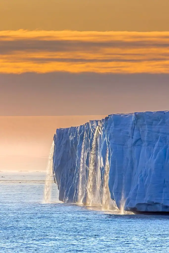 Waterfall at edge of Brasvellbreen glacier from the ice cap Austfonna pouring into the Barents Sea in Nordaustlandet, Svalbard, as polar ice caps melt at record rate (Arterra/Sven-Erik Arndt/Universal Images Group via Getty Images)
