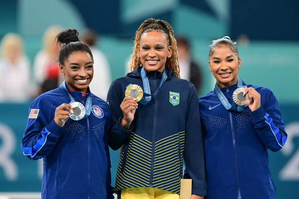 Silver medallist Simone Biles, gold medallist Rebeca Andrade, and Jordan Chiles - who was eventually forced to give up her bronze medal (Mehmet Murat Onel/Anadolu via Getty Images)