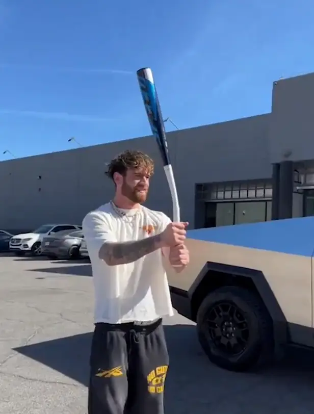 After multiple hard swings to the car’s body, there appears to be no clear damage.