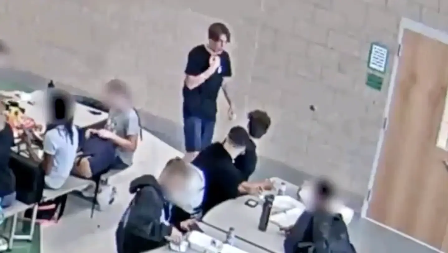 Jackson used the 'international sign' to show his pals he was choking.