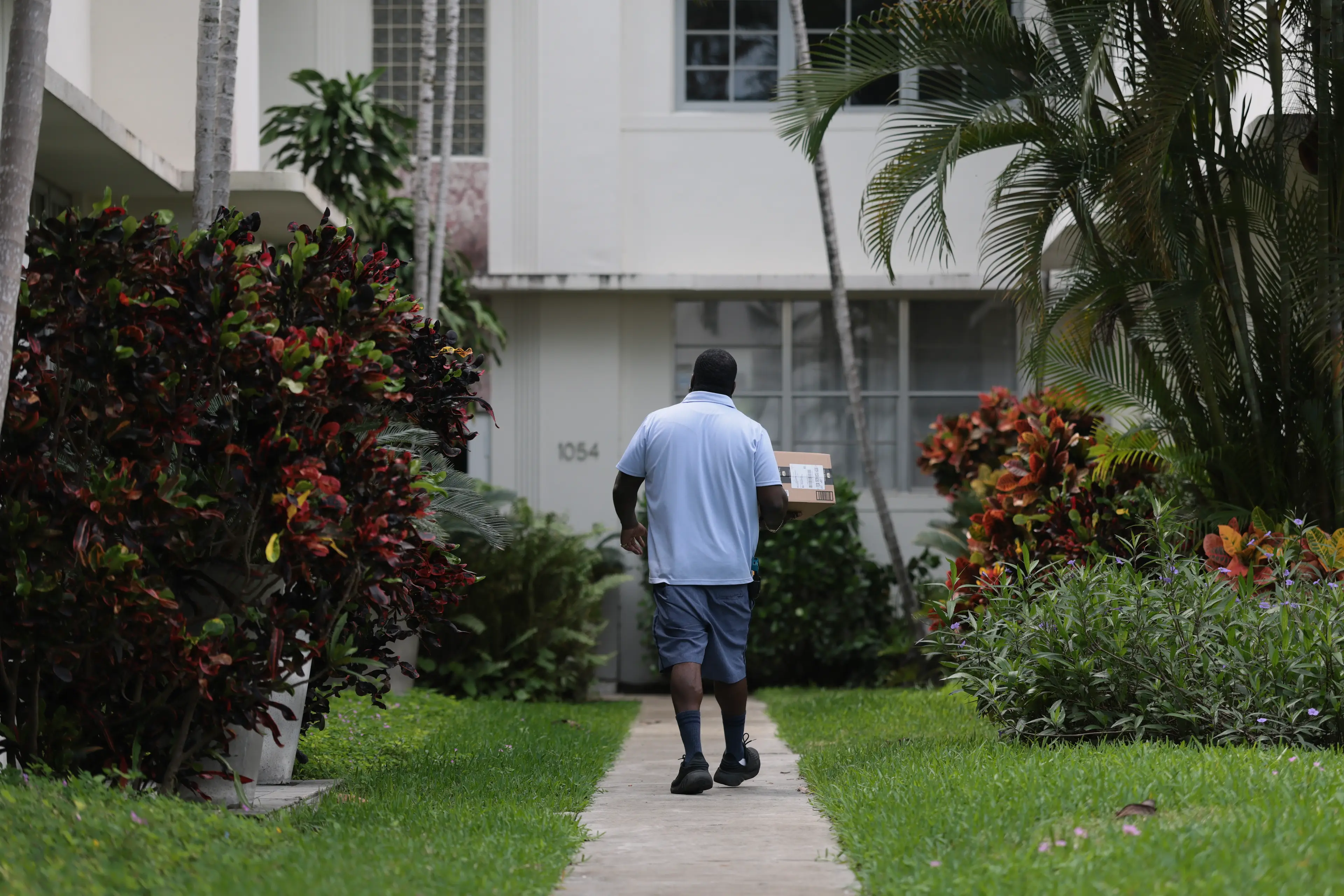 To avoid hefty fines, you should safely hand any misdelivered mail directly back to your local postal worker (Joe Raedle/Getty Images)