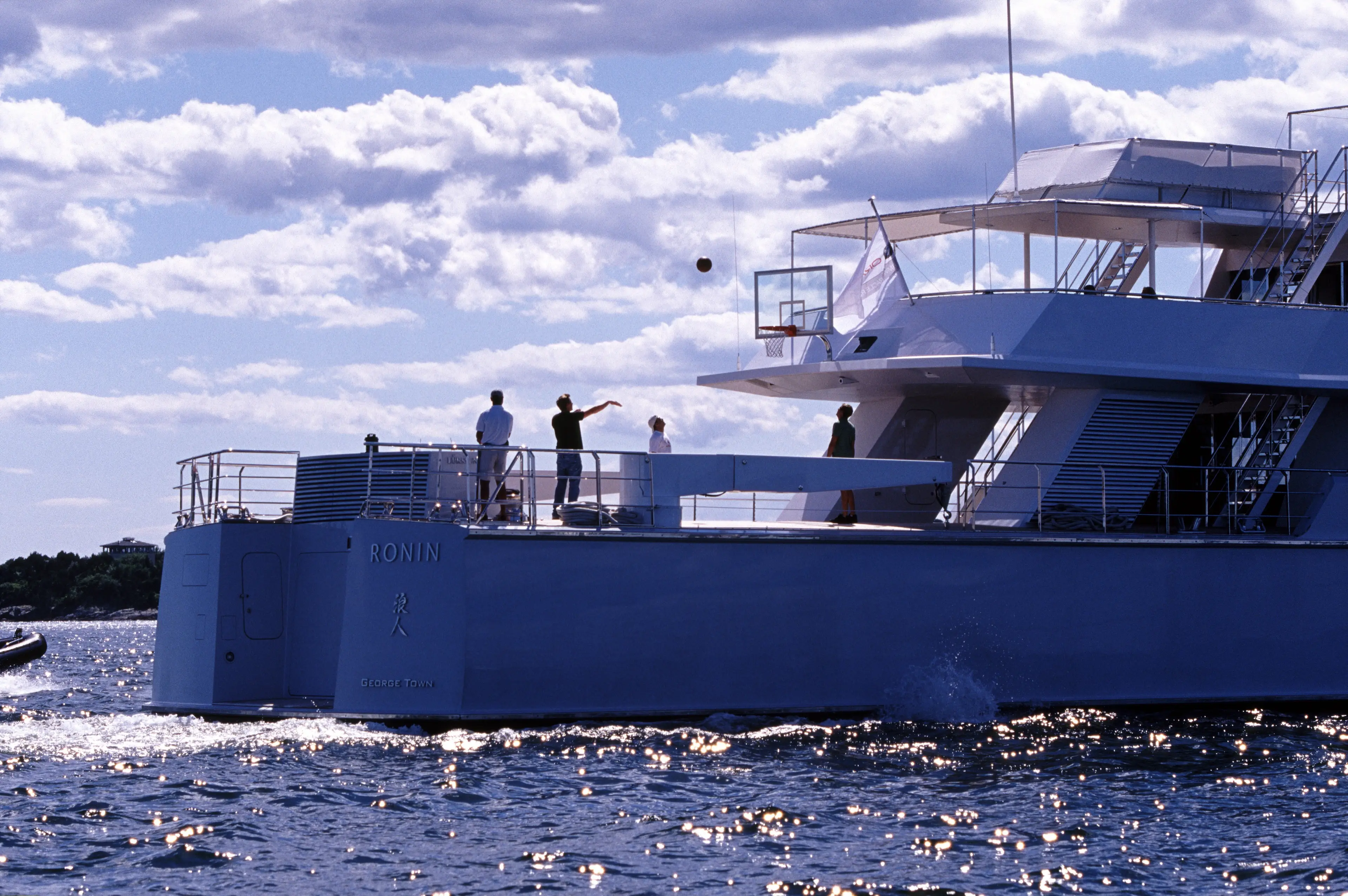 Pictured in 2004, Ellison playing basketball on his hastily renamed yacht (Heinrich Hecht/ullstein bild via Getty Images)