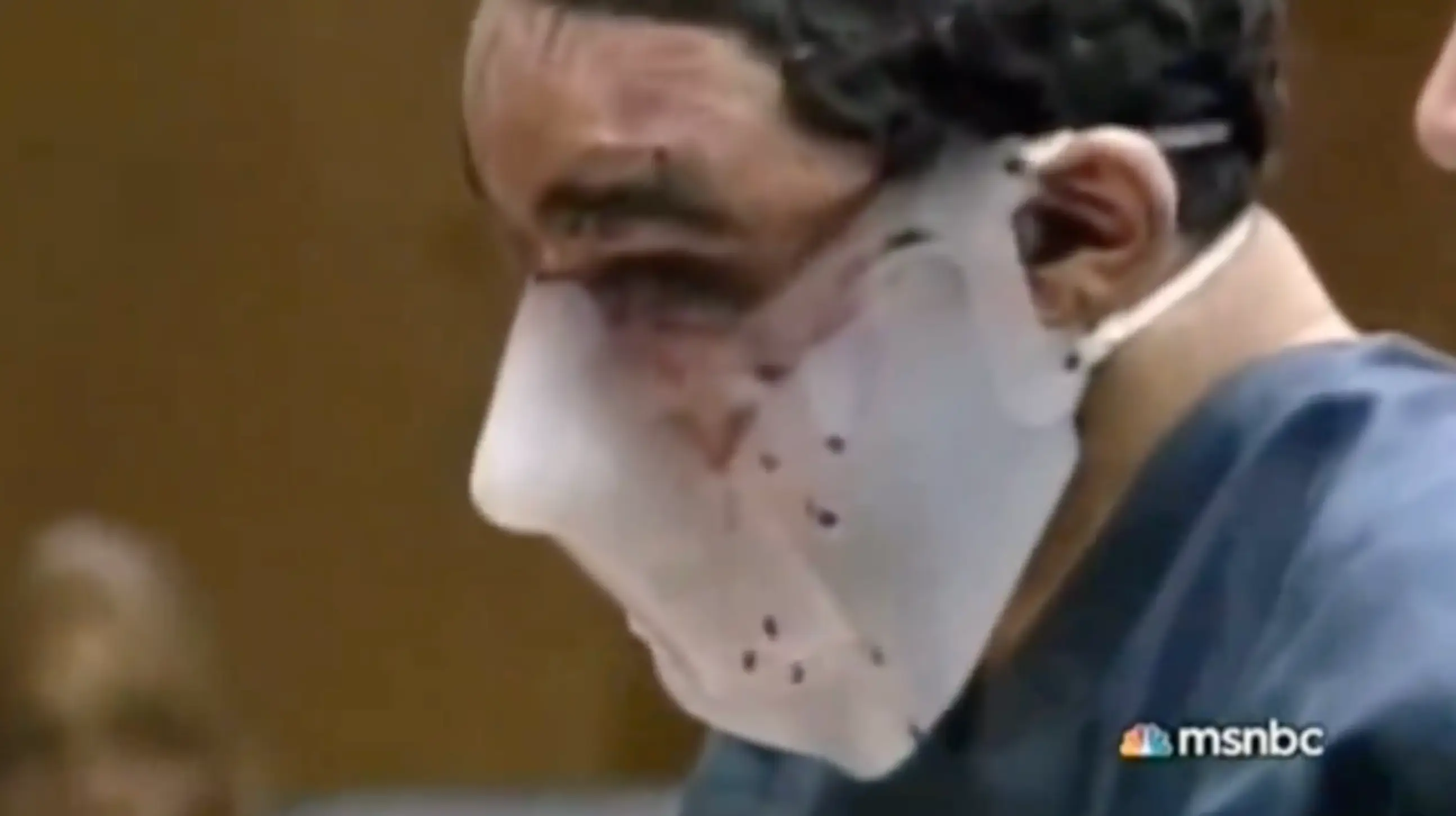 The cop killer entered court wearing a strange mask (MSNBC)