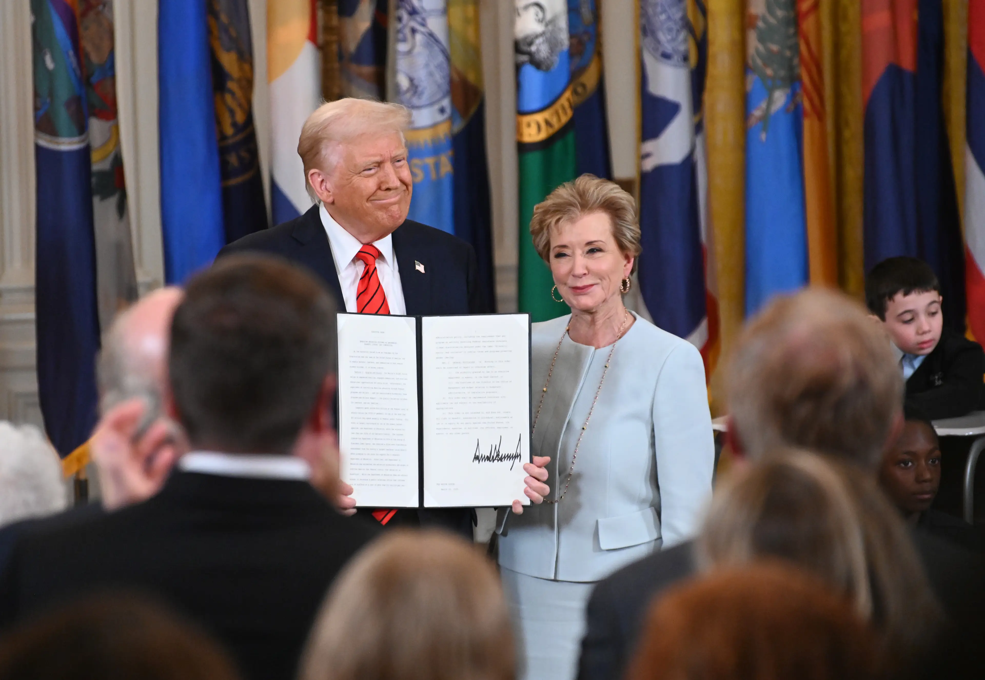 Trump pictured with U.S. Education Secretary Linda McMahon (Chen Mengtong/China News Service/VCG via Getty Images)