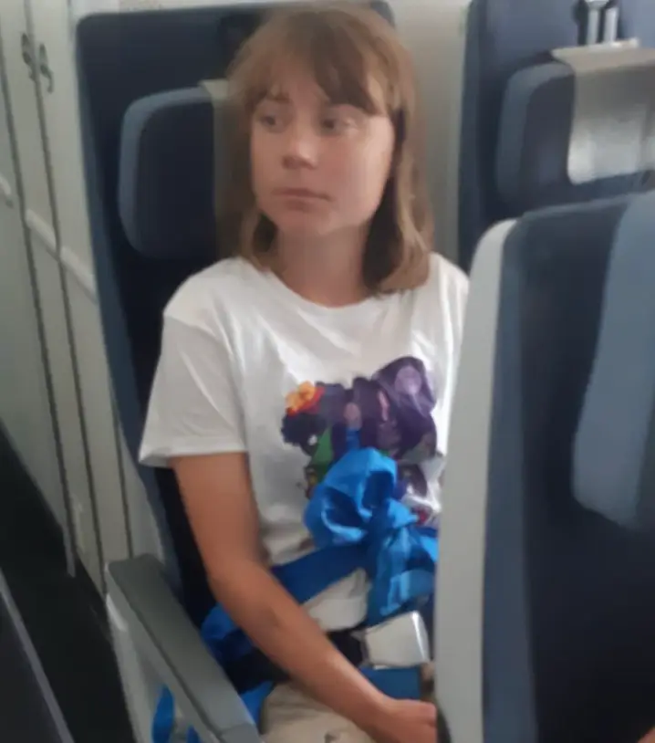 Thunberg pictured on her flight back to Sweden (@IsraelMFA/Twitter)