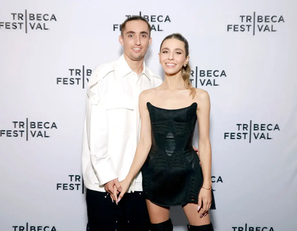 The couple on the top of the building are said to be 'daredevil climbers' Angela Nikolau and Ivan Beerkus (Photo by Jason Mendez/Getty Images for Netflix)